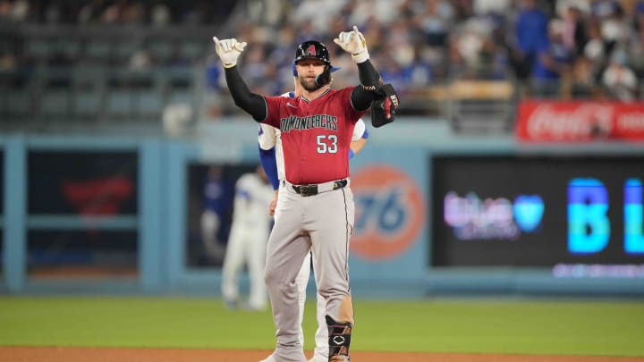 Jul 3, 2024; Los Angeles, California, USA; Arizona Diamondbacks first baseman Christian Walker (53) gestures after hitting a double in the sixth inning against the Los Angeles Dodgers at Dodger Stadium. Mandatory Credit: Kirby Lee-USA TODAY Sports