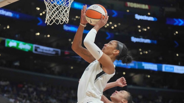  Las Vegas Aces center A'ja Wilson shoots the ball against LA Sparks forward Dearica Hamby 