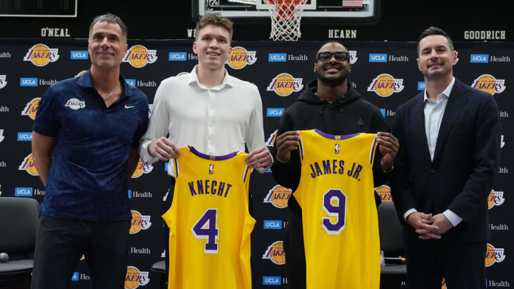 Jul 2, 2024; El Segundo, CA, USA; From left: Los Angeles Lakers general manager Rob Pelinka, first round draft pick Dalton Knecht (4), second round draft pick Bronny James (9) and coach JJ Redick pose Kat a press conference at the UCLA Health Training Center. Mandatory Credit: Kirby Lee-USA TODAY Sports