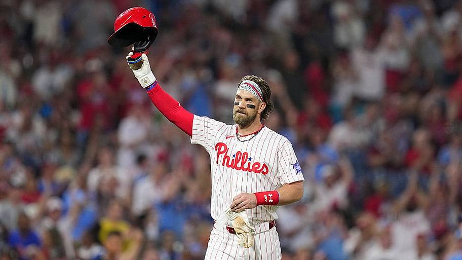 Phillies DH Bryce Harper tips his helmet to the crowd after hitting for the cycle