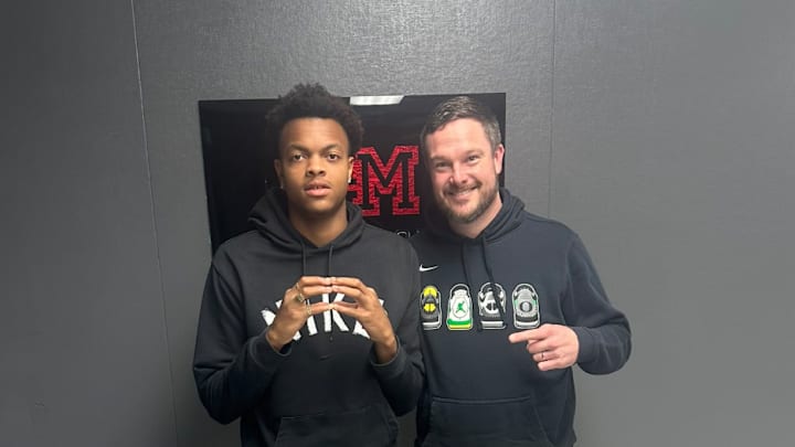 Five-star athlete Brandon Arrington poses with Oregon Ducks coach Dan Lanning