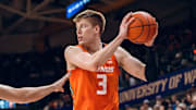 Illinois forward Ben Humrichous (3) protects the ball in the Illini's 80-77 win over Washington on Sunday at Alaska Airlines Arena in Seattle.