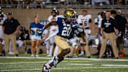 UC Davis running back Jordan Fisher (20)