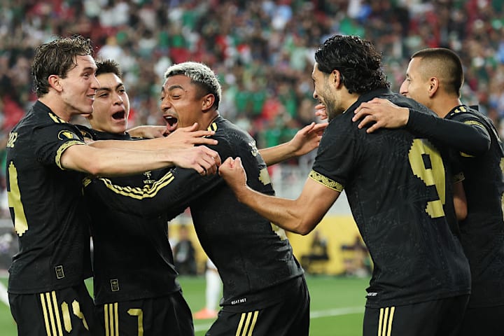 Mexico national team players celebrating. 