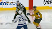 Toronto Maple Leafs F Matthew Knies and Vegas Golden Knights D Zach Whitecloud fight in the first period. 