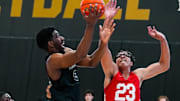 Vanderbilt's AK Okereke drives on Jayden Leverett