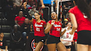 Skyler Pierce, left, and Manaia Ogbechie celebrate after a point at Rutgers. Pierce tied a career best with six kills, while Ogbechie set a season best with eight blocks.