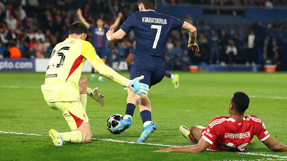 Giorgi Mamardashvili challenges for the ball