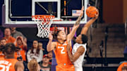Illinois guard Dra Gibbs-Lawhorn (2) rises up to challenge the shot of a Washington player in the Illini's 77-75 win over the Huskies on Sunday at Alaska Airlines Arena in Seattle.