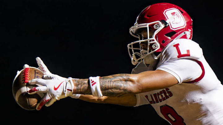 Orange Lutheran's Nico Bland put Orange Lutheran on the board first with a long touchdown catch, setting the stage for the Lancers huge playoff upset.