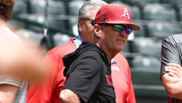 Arkansas Razorbacks coach Dave Van Horn visiting with national media at practice for the Super Regional against the Tennessee Volunteers at Baum-Walker Stadium in Fayetteville, Ark.