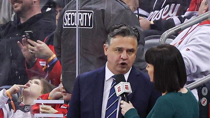 New Jersey Devils interim head coach Travis Green talks with ESPN reporter Leah Hextall during the first period of the NHL against the St. Louis Blues at Prudential Center on March 7, 2024. New Jersey Devils interim head coach Travis Green talks with ESPN reporter Leah Hextall during the first period of the NHL against the St. Louis Blues at Prudential Center on March 7, 2024.