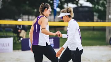 TCU women’s beach volleyball players playing in the Duke Kahanamoku Beach Classic. 