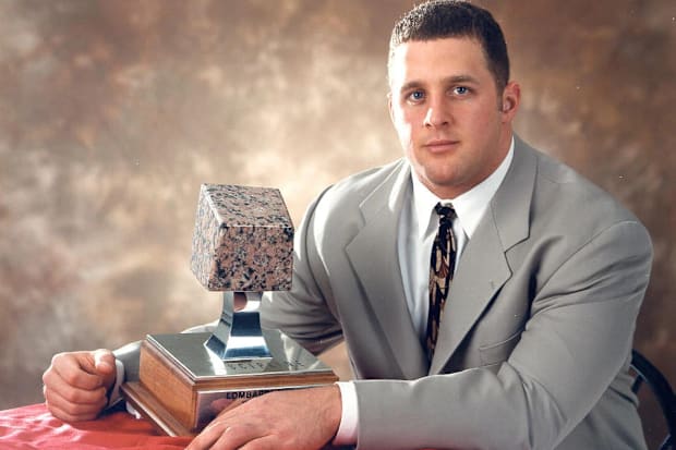 Grant Wistrom with the Lombari Trophy.