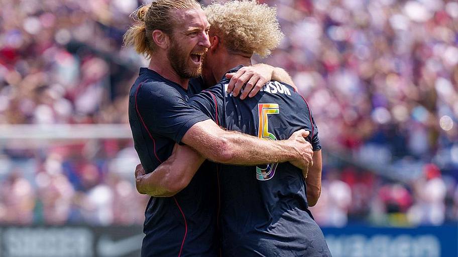 Tim Ream hugging Robinson
