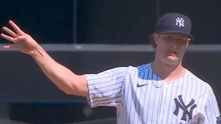 New York Yankees starting pitcher Gerrit Cole signals for an intentional walk of Boston Red Sox star Rafael Devers in the top of the fourth inning of Saturday's game at Yankee Stadium. 