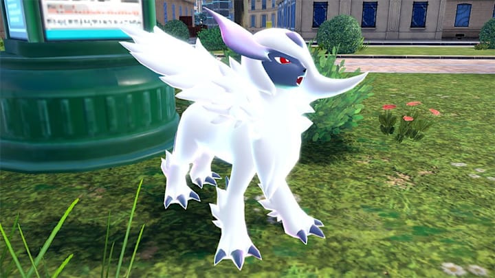 Mega Absol standing in a grassy patch in town.