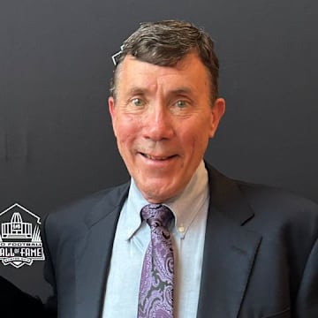 Longtime former Vikings equipment manager Dennis Ryan with his award from the Pro Football Hall of Fame.