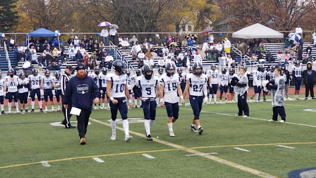 Portland Bulldogs walking up at the 2023 Maine high school football state championships. 
