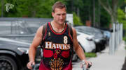 Atlanta Falcons quarterback Kirk Cousins repping an Atlanta Hawks Jersey