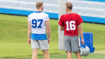 Detroit Lions Jared Goff speaks to Aidan Hutchinson