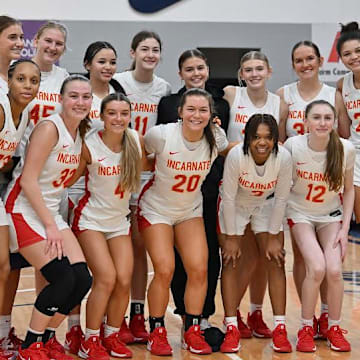 WNBA star Sophie Cunningham (left), a Columbia, Mo. native who currently plays for the Phoenix Mercury, poses with the Incarnate Word girls basketball team after they beat Blue Valley North 68-51 Saturday, Jan. 11, in the Sophie Cunningham Classic in Columbia for their 139th consecutive win - breaking the national all-time consecutive wins record. Incarnate Word went on to win the program's 15th state championship on Thursday, March 20 in Columbia at Mizzou Arena.