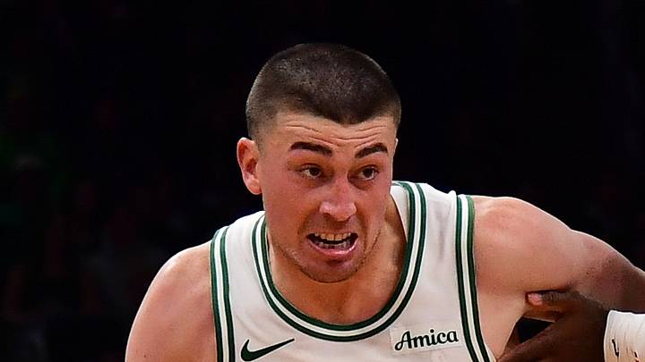 Oct 14, 2026; Boston, Massachusetts, USA;  Boston Celtics guard Payton Pritchard (11) controls the ball while Charlotte Hornets forward Royce O'Neale (00) defends during the first half at TD Garden. Mandatory Credit: Bob DeChiara-Imagn Images