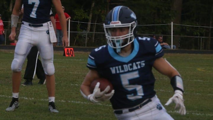 York's Mike Hanlon looks for the end zone during Saturday's 54-14 win over New Hampshire Division IV Hillsboro-Deering.