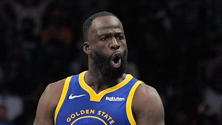 Dec 31, 2025; Charlotte, North Carolina, USA; Golden State Warriors forward Draymond Green (23) reacts to his three point basket during the second half against the Charlotte Hornets at Spectrum Center. Mandatory Credit: Jim Dedmon-Imagn Images