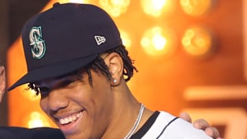 MLB Commissioner Rob Manfred takes a photo with Jurrangelo Cijntje after being drafted by the Seattle Mariners with the 15th pick during the first round of the MLB Draft at Cowtown Coliseum in 2024. 