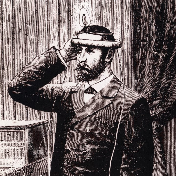 Drawing of Nikola Tesla wearing a lightbulb apparatus on his head