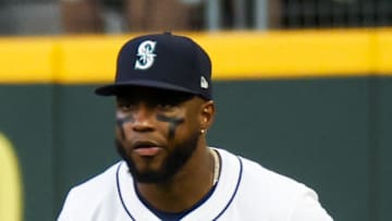 Seattle Mariners right fielder Victor Robles (10) watches a pitch against the Athletics during the fourth inning at T-Mobile Park on Aug. 23. 