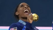 Jul 30, 2024; Paris, France; Simone Biles of the United States celebrates with her gold medal after the women’s team final at the Paris 2024 Olympic Summer Games at Bercy Arena. Mandatory Credit: Jack Gruber-USA TODAY Sports