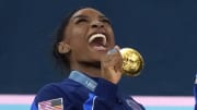 Jul 30, 2024; Paris, France; Simone Biles of the United States celebrates with her gold medal after the women’s team final at the Paris 2024 Olympic Summer Games at Bercy Arena. Mandatory Credit: Jack Gruber-USA TODAY Sports