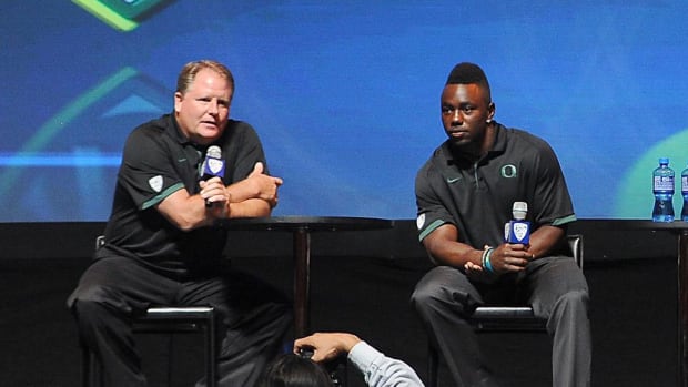 July 24, 2012; Los Angeles, CA, USA;    Oregon Ducks head coach Chip Kelly (left), running back Kenjon Barner (center), and l