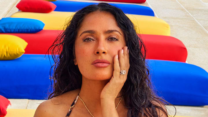 Salma Hayek Pinault was photographed by Ruven Afanador in Mexico. Swimsuit by Sommer Swim. Necklace by Jacquie Aiche.