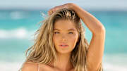 Ellie Thumann was photographed by Yu Tsai in Mexico. Swimsuit top by Nué Studio. Swimsuit bottom by Oséree. 
