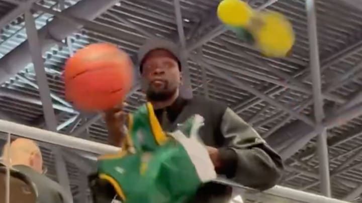 Kevin Durant dodges objects thrown by hopeful fans. Kevin Durant dodges objects thrown by hopeful fans.