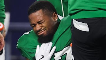 Nov 23, 2025; Arlington, Texas, USA; Philadelphia Eagles wide receiver Xavier Gipson (87) winces in pain in the fourth quarter against the Dallas Cowboys at AT&T Stadium. Mandatory Credit: Kevin Jairaj-Imagn Images