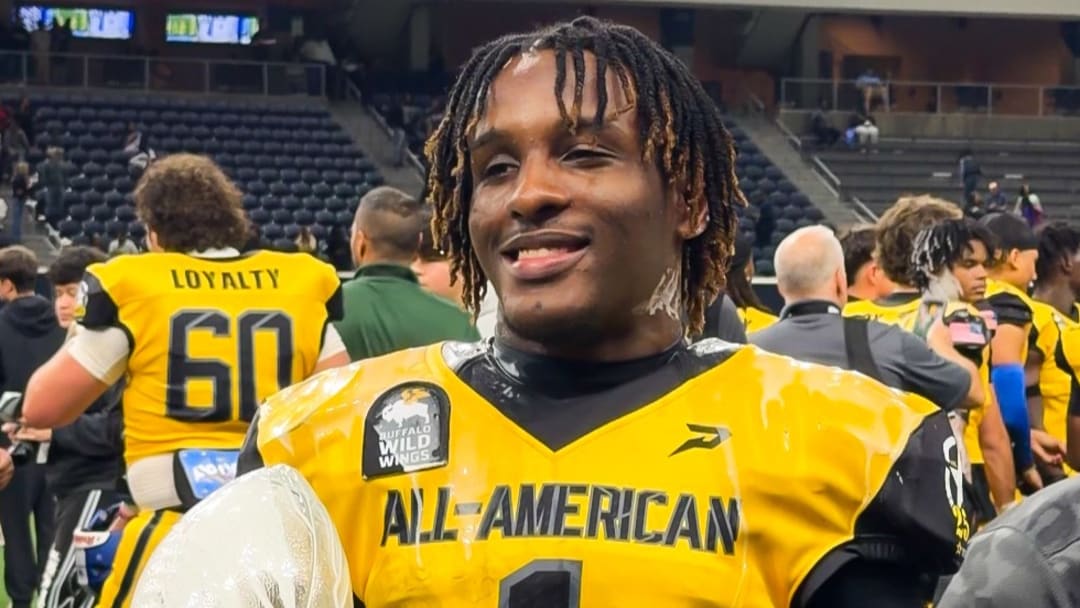 Running Back Cam Newton holds All-American Trophy at Military Appreciation Bowl