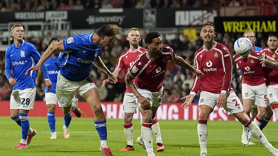 Phil Neumann (left) scores his sides second goal during the Sky Bet Championship match.