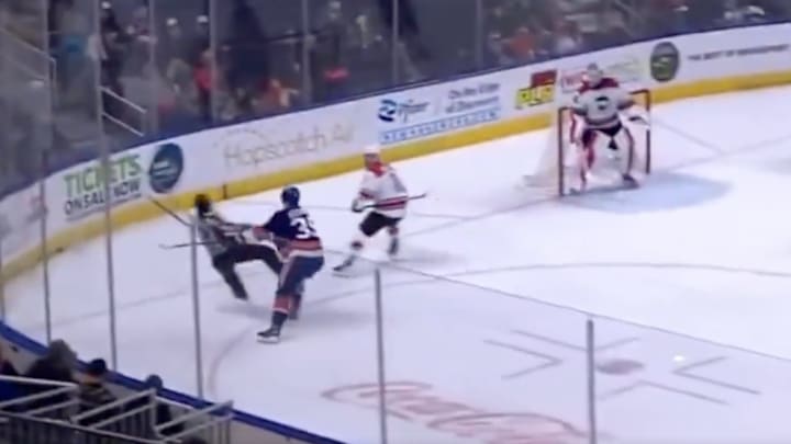 Bridgeport Islanders LW Adam Beckman shoves a referee. Bridgeport Islanders LW Adam Beckman shoves a referee.