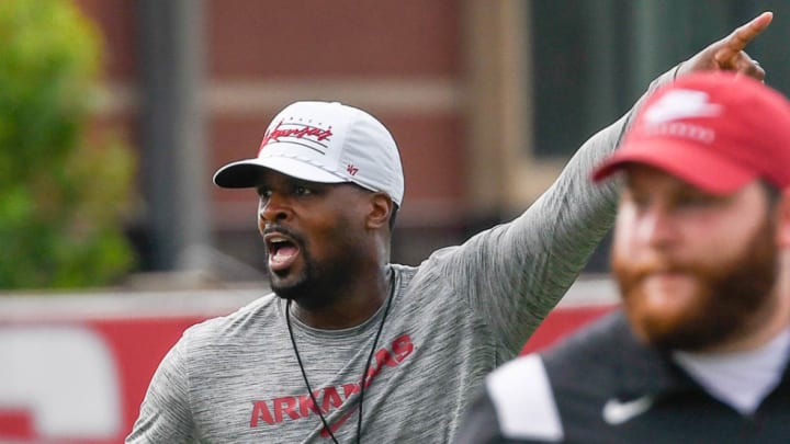 Arkansas Razorbacks defensive coordinator Travis Williams instructs unit during practice.