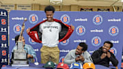 Stepinac High School basketball star Jasiah Jervis unveils a Michigan State University t-shirt as he announces which college he will be attending and playing basketball at during a ceremony at Stepinac High School in White Plains Nov. 5, 2025. With Jasiah was his mother Falana, his father Rhodes, and brother Jafari.