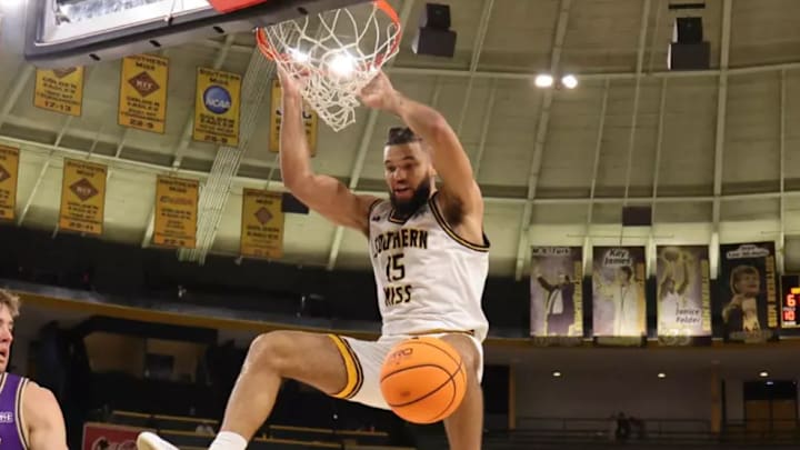 Djahi Binet throws down a dunk at Reed Green Coliseum. Djahi Binet throws down a dunk at Reed Green Coliseum.