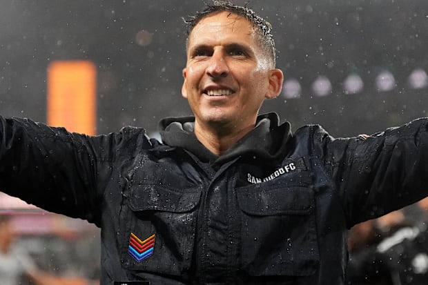 Mikey Varas with arms outstretched.