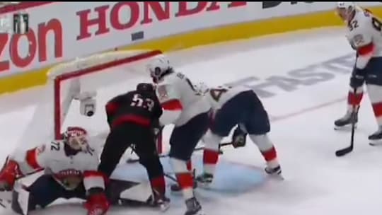 Carolina Hurricanes forward Jackson Blake scores a goal against the Florida Panthers but takes a late hit from Aaron Ekblad.