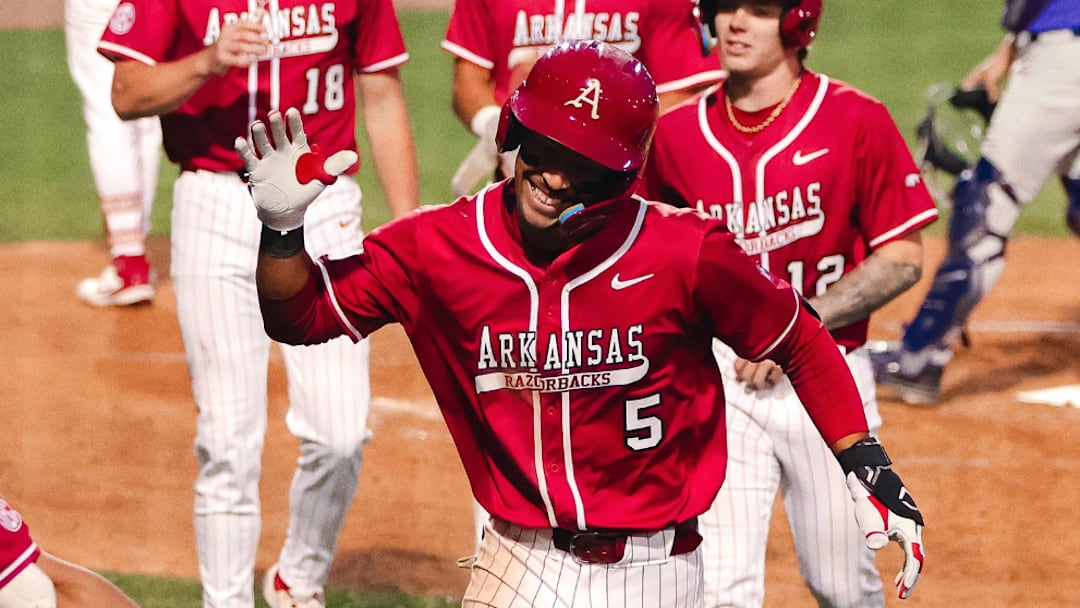 Arkansas third baseman TJ Pompey celebrates a home run against Central Arkansas at Baum-Walker Stadium.