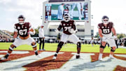 Mississippi State Offensive Lineman Ethan Miner (#67), Mississippi State Offensive Lineman Jacoby Jackson (#75) and Mississippi State Offensive Lineman Luke Work (#51) during the game between the UMass Minute Men and the Mississippi State Bulldogs at Davis Wade Stadium at Scott Field in Starkville, MS.