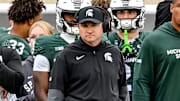Michigan State's head coach Jonathan Smith, center, looks on from the sideline during the third quarter in the game against UCLA on Saturday, Oct. 11, 2025, at Spartan Stadium in East Lansing.